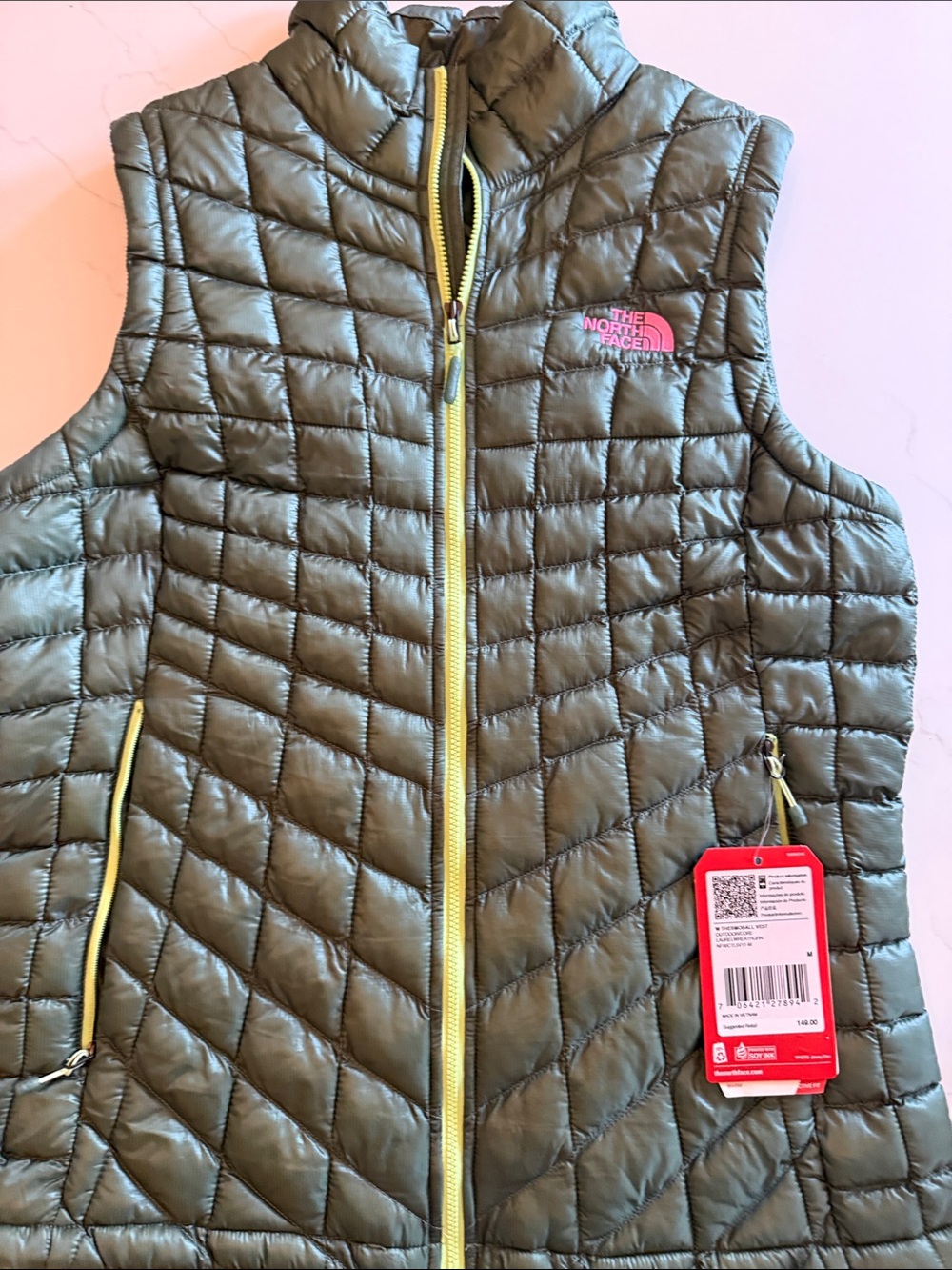 The North Face Olive Green Quilted Vest with Yellow Trim